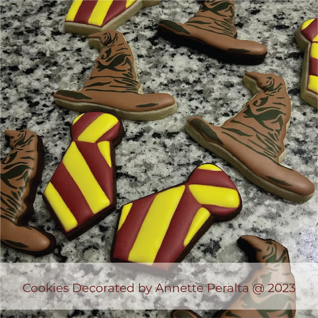 Picture of wizard school sorting hat and uniform tie decorated cookies.