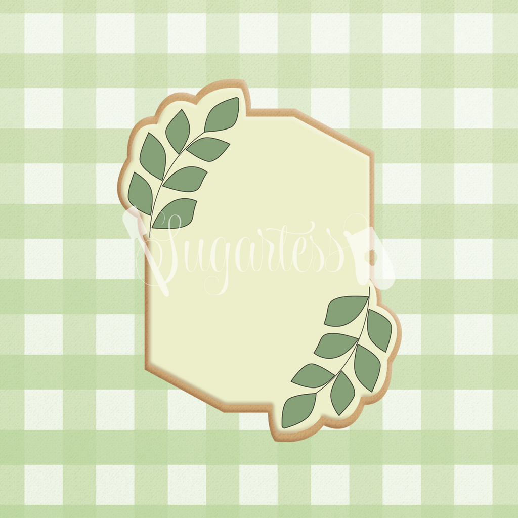Sugartess custom cookie cutter in shape of a rectangular geometric plaque with greenery.
