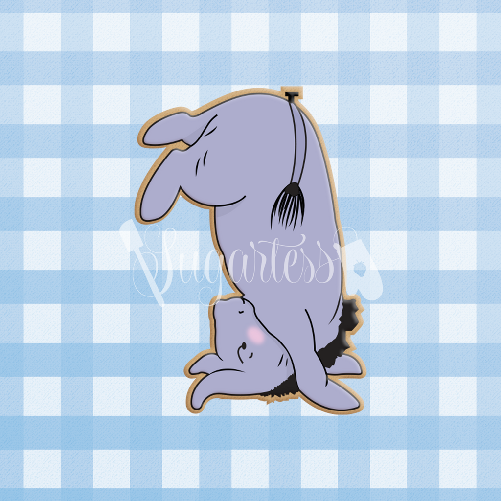 Sugartess custom cookie cutter in shape of vintage classic Eeyore donkey in headstand position.