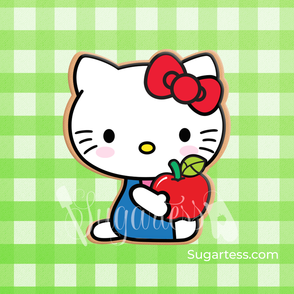 Sugartess custom cookie cutter in shape of Kitty character sitting and holding an apple.