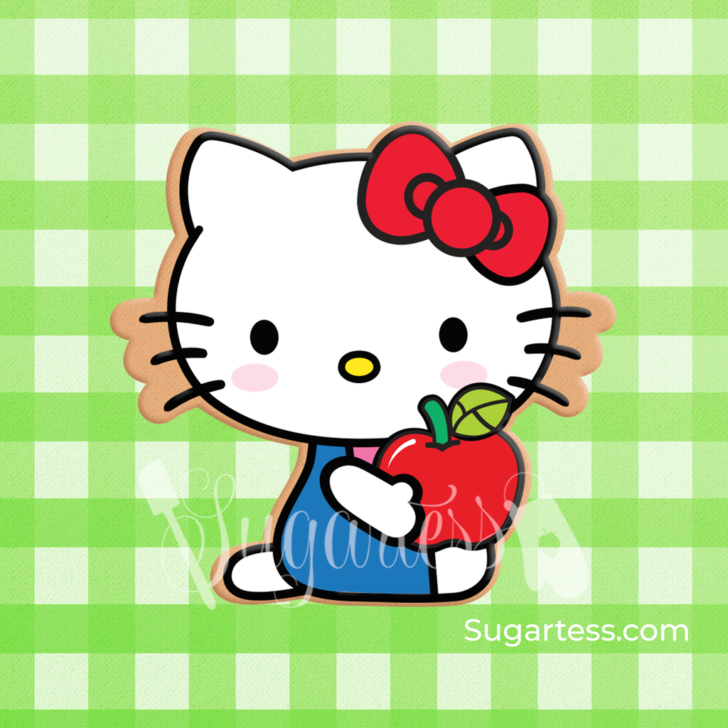 Sugartess custom cookie cutter in shape of Kitty character sitting holding an apple.