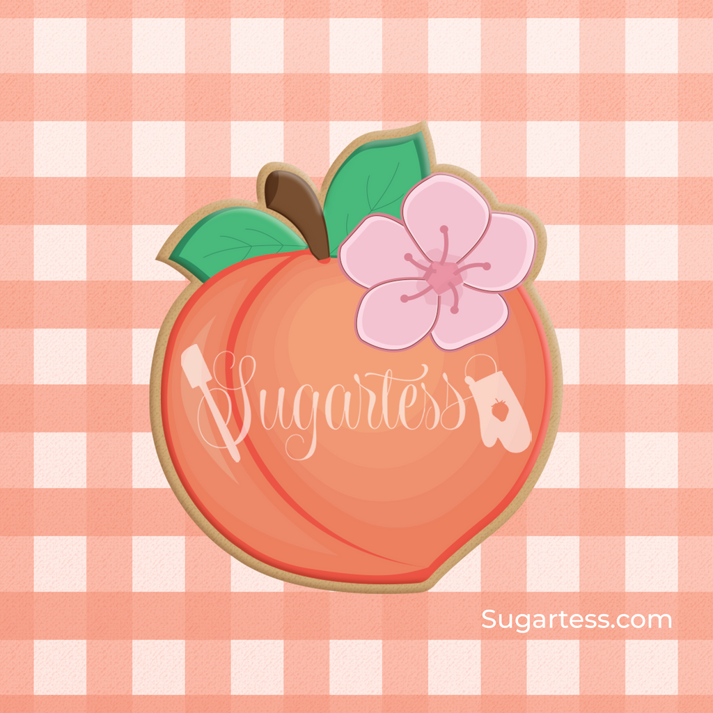 Sugartess custom cookie cutter in shape of a peach fruit with a flower blossom.