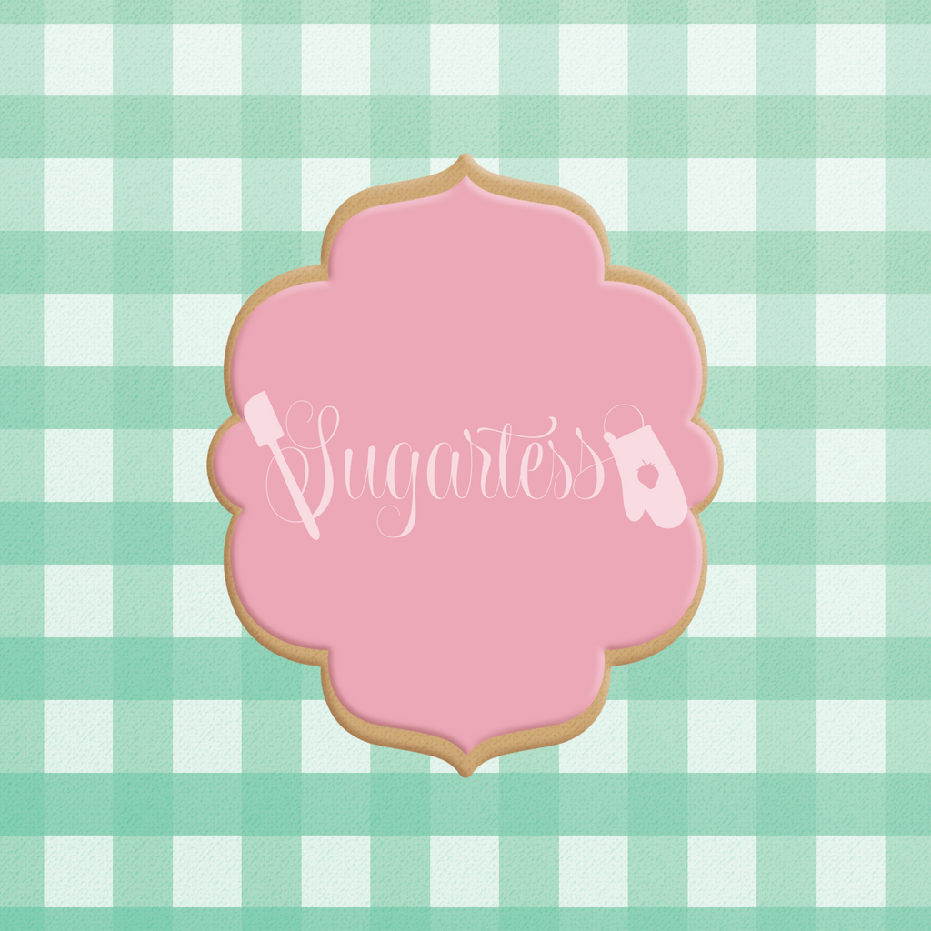 Sugartess custom cookie cutter in shape of an ornate plaque frame.