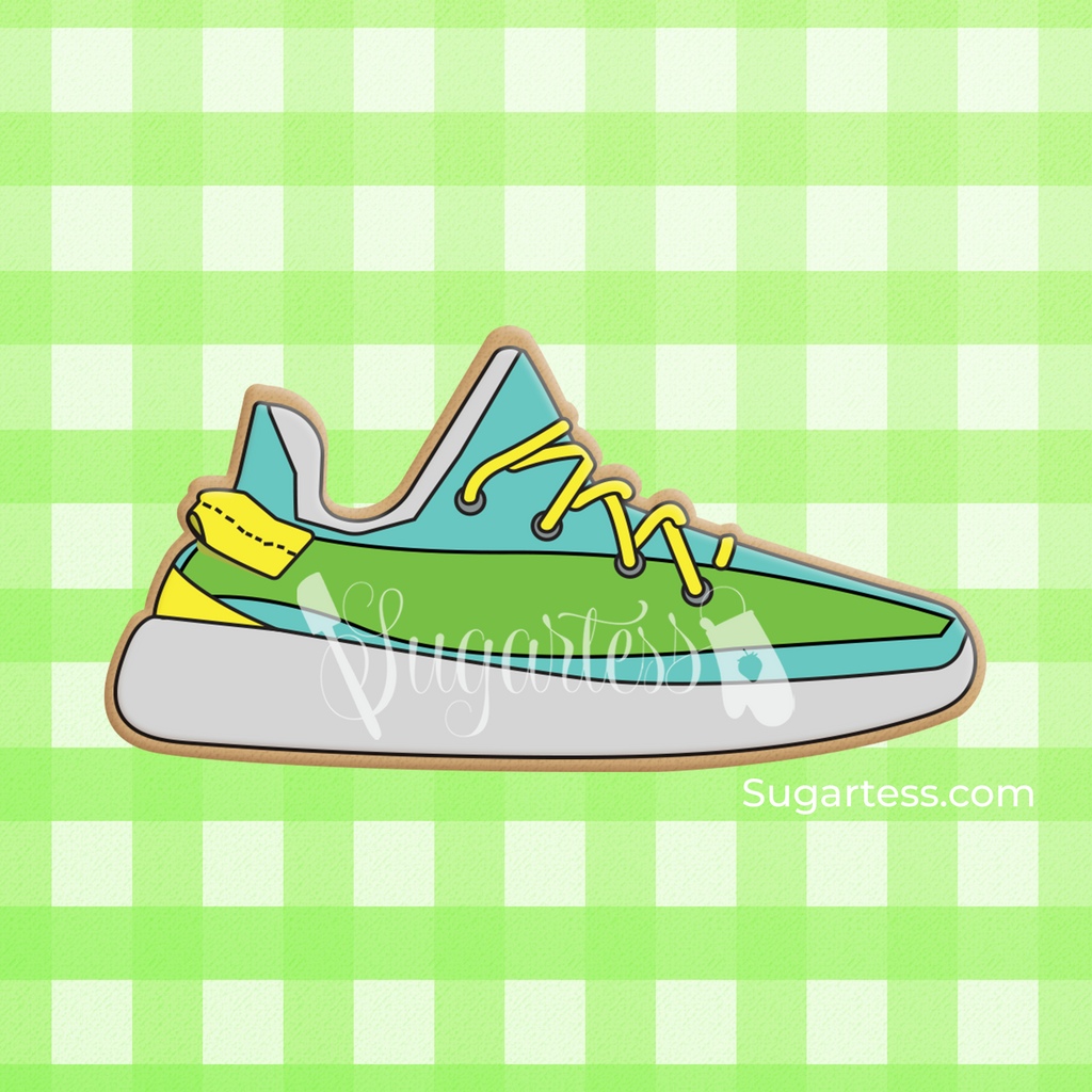 Sugartess custom cookie cutter in shape of a teal and green sneaker tennis shoe.