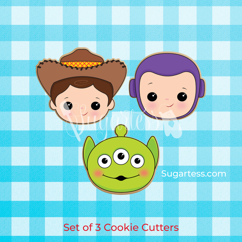 Sugartess custom cookie cutters in shape of Toy Story character heads: Woody cowboy, Buzz space ranger, and green alien.