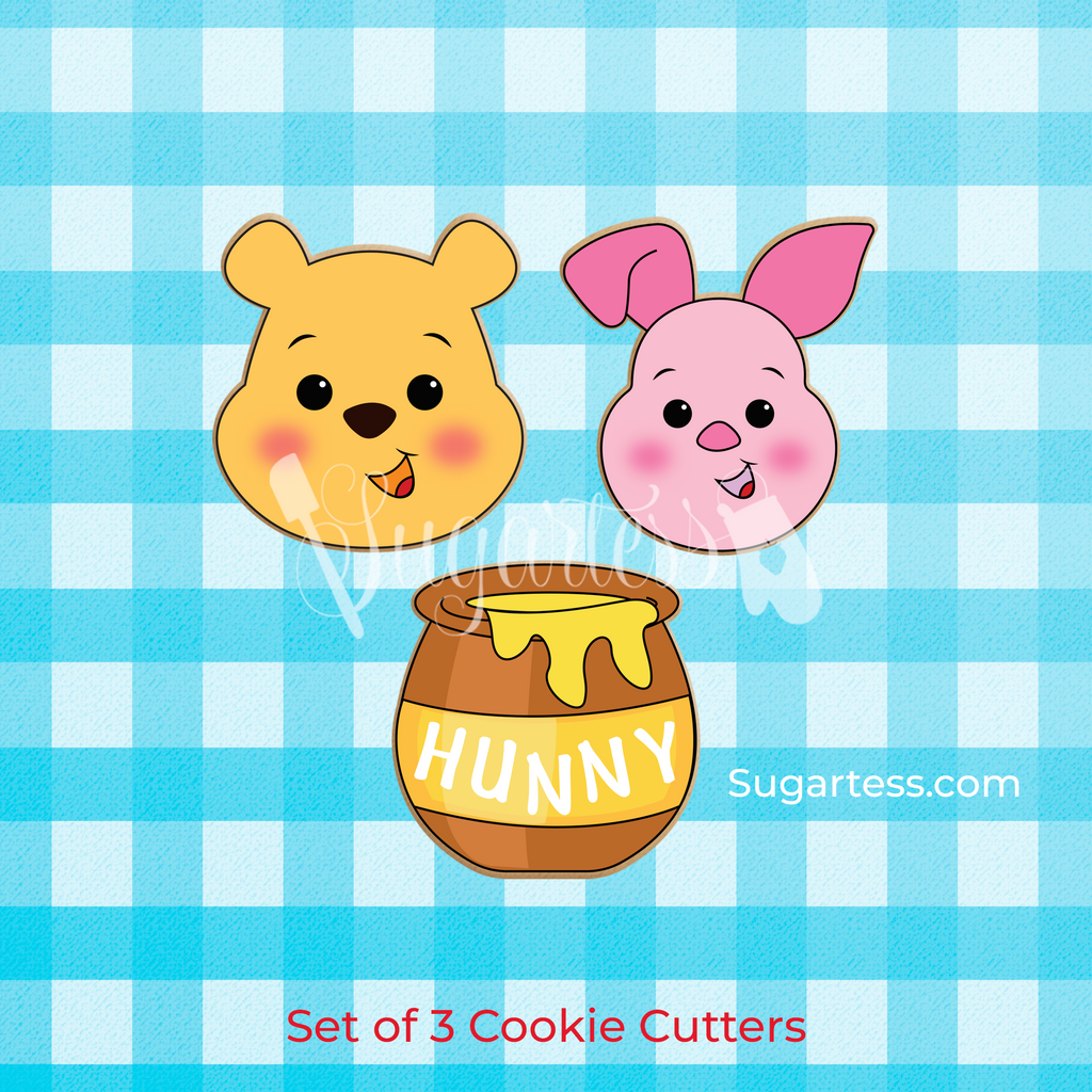 Sugartess custom cookie cutters in shape of cute character heads: Pooh bear, Piglet, and honey pot.