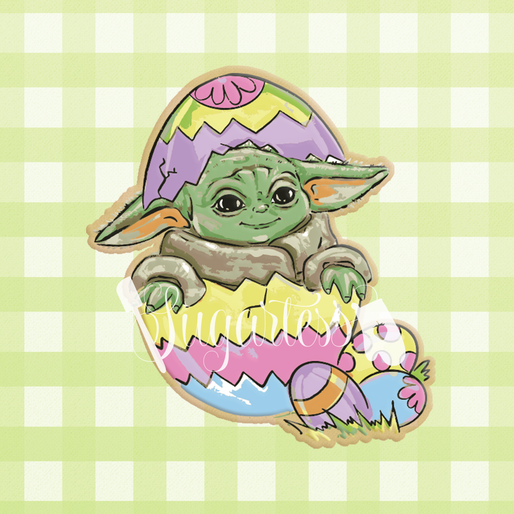 Sugartess custom cookie cutter in shape of peek-a-boo Baby Yoda coming out of Easter egg.
