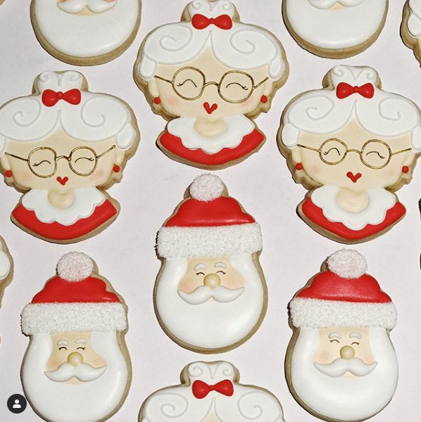 Santa Claus and Mrs. Santa Claus's head decorated cookies.
