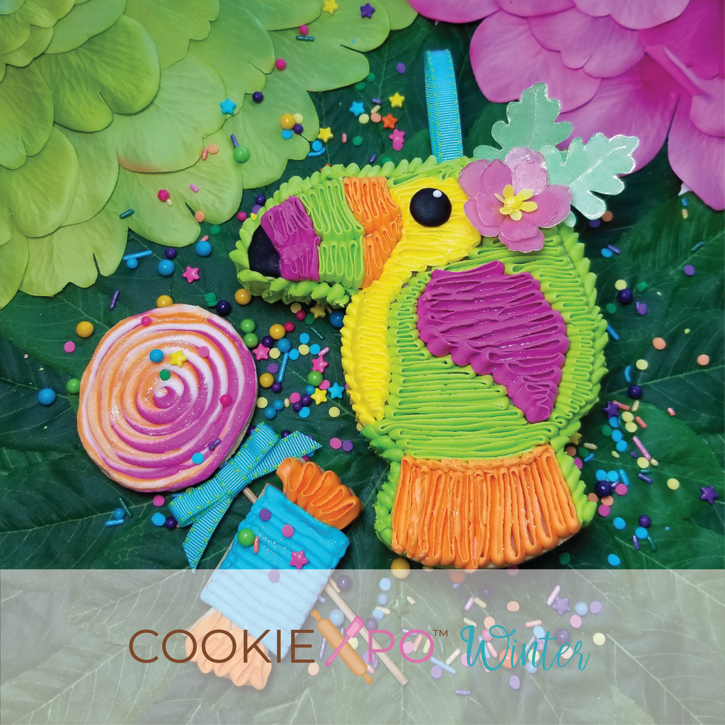 Sugartess fiesta cookie cutter in shape of a girl toucan bird piñata with a flower on head.