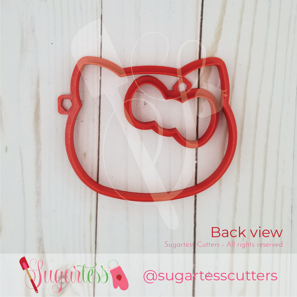 Sugartess custom cookie cutter set of character kitty head and head bow.