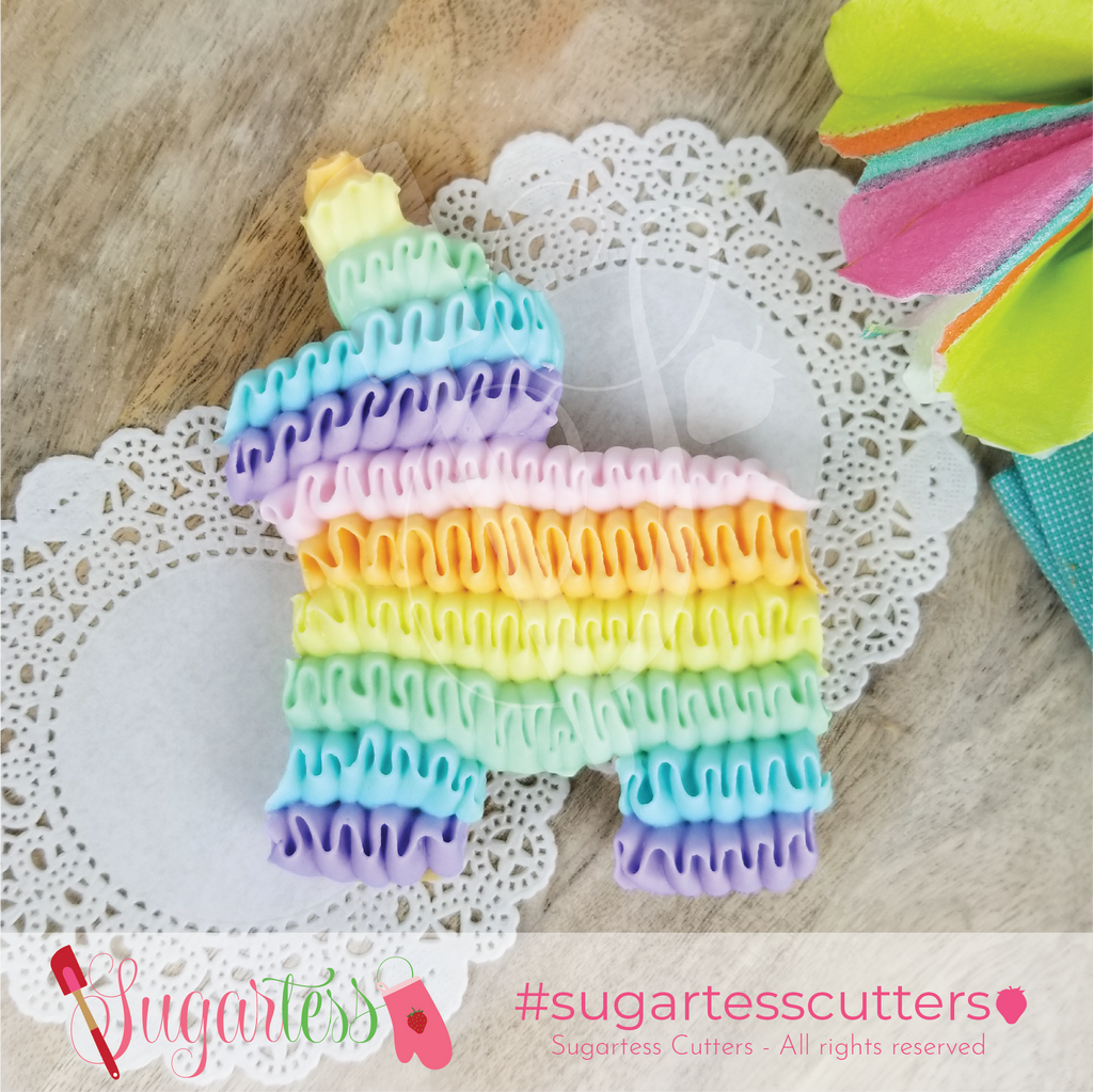 Sugartess classic Mexican burrito (donkey) piñata cookie decorated with royal icing ruffles in pastel colors.