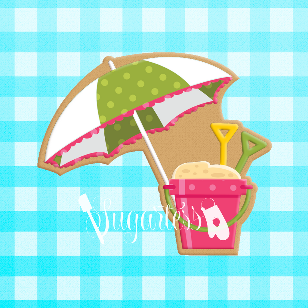 Sugartess custom cookie cutter in shape of beach scenery of umbrella and sand bucket.