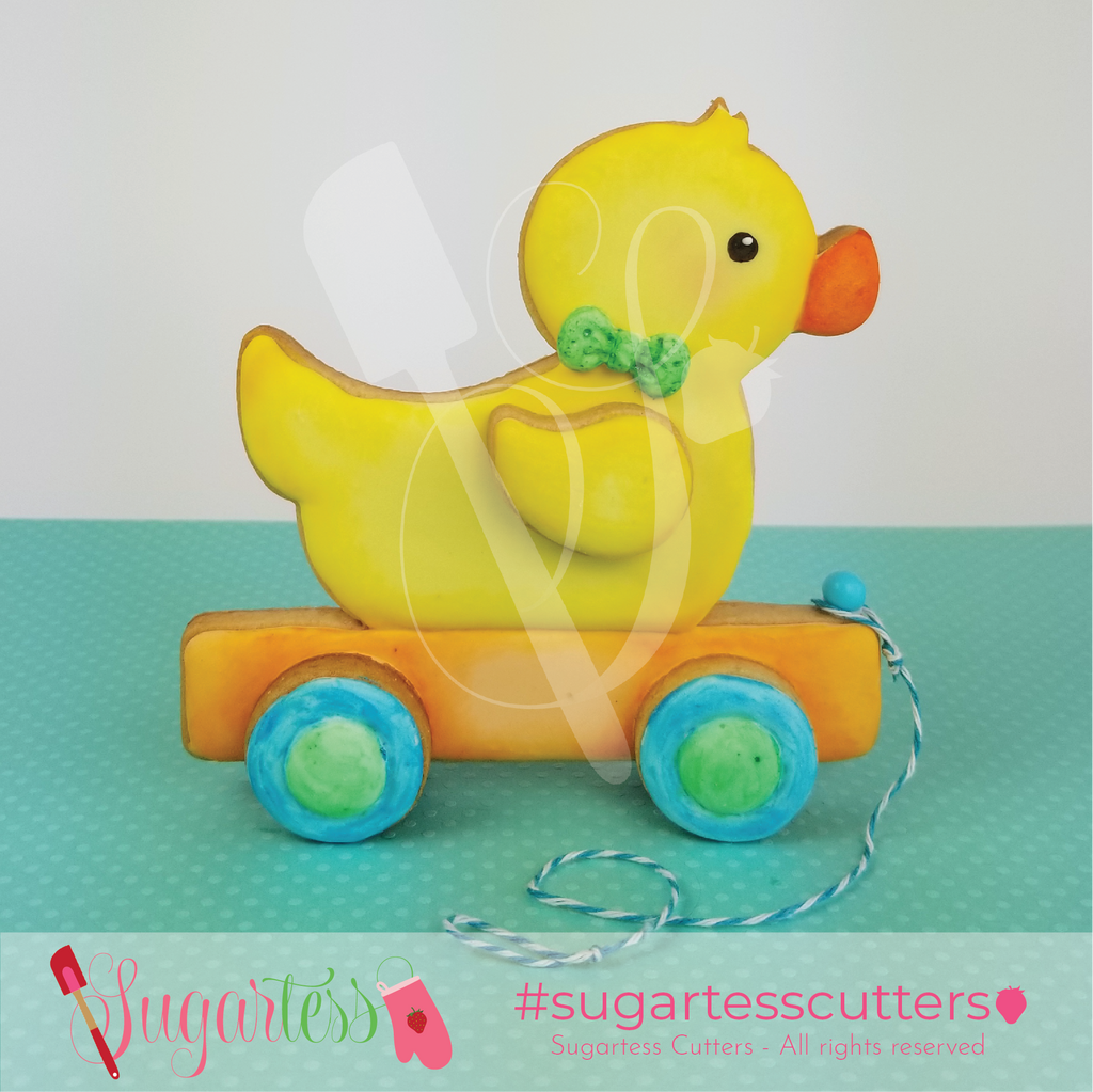 Sugartess pull along boy toy duck decorated 3-D cookie.