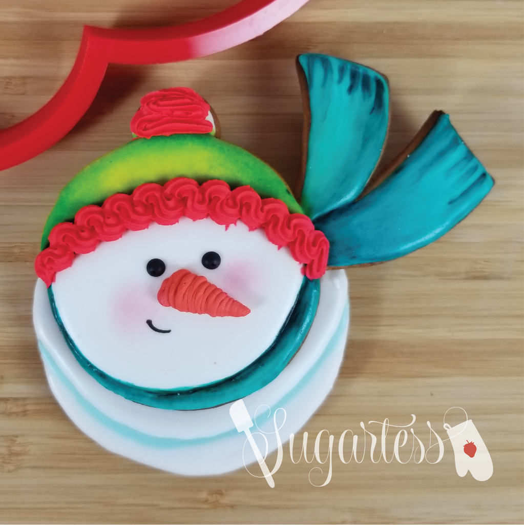 Sugartess decorated cookie of Frosty The Snowman looking up and wearing very long scarf. Reference image of our custom cookie cutter.