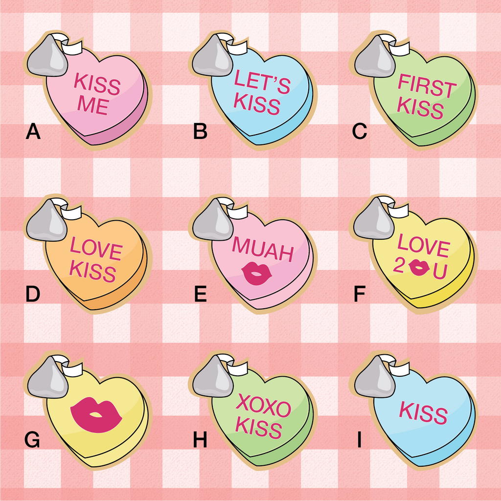 Sugartess custom Valentine's Day cookie cutter in shape of conversation candy hearts with different message options and Hershey's Kiss chocolate on the side: Kiss Me, Let's Kiss, First Kiss, Muah, Kiss, XOXO Kiss and other.