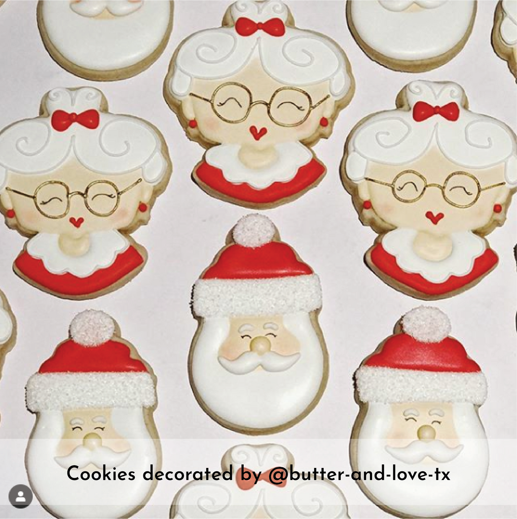 Santa Claus and Mrs. Santa Claus's head decorated cookies.