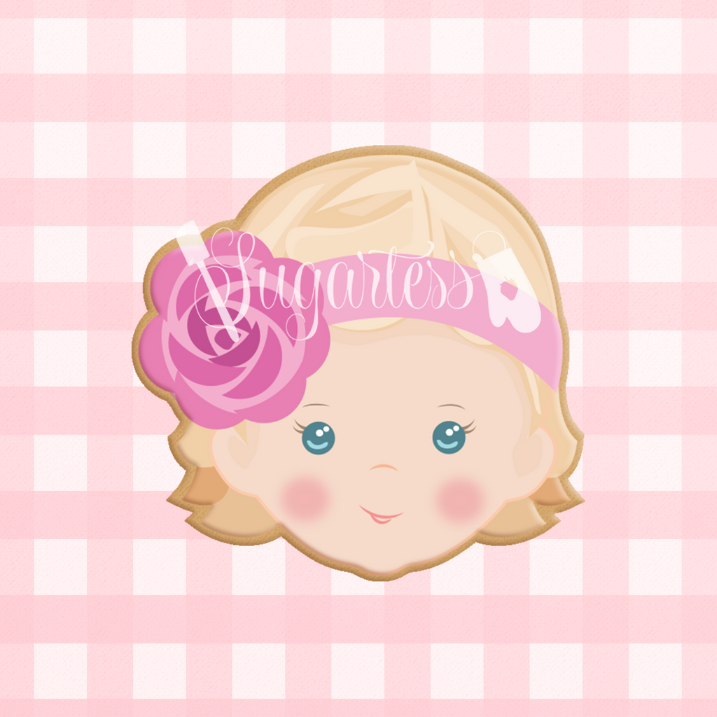 Sugartess custom cookie cutter in shape of a baby girl head with floral headband.