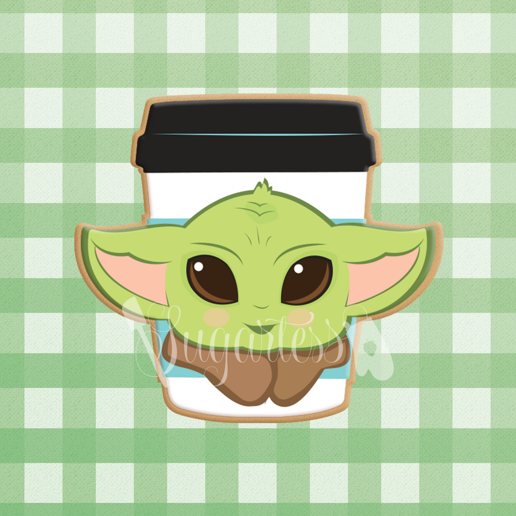 Sugartess custom cookie cutter in shape of coffee cup decorated with Baby Yoda head.
