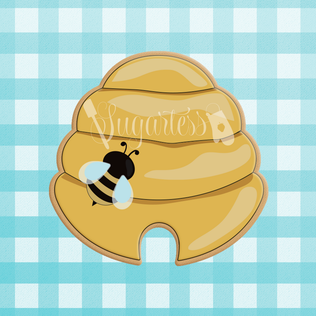 Sugartess custom cookie cutter in shape of beehive with cutout bottom door.