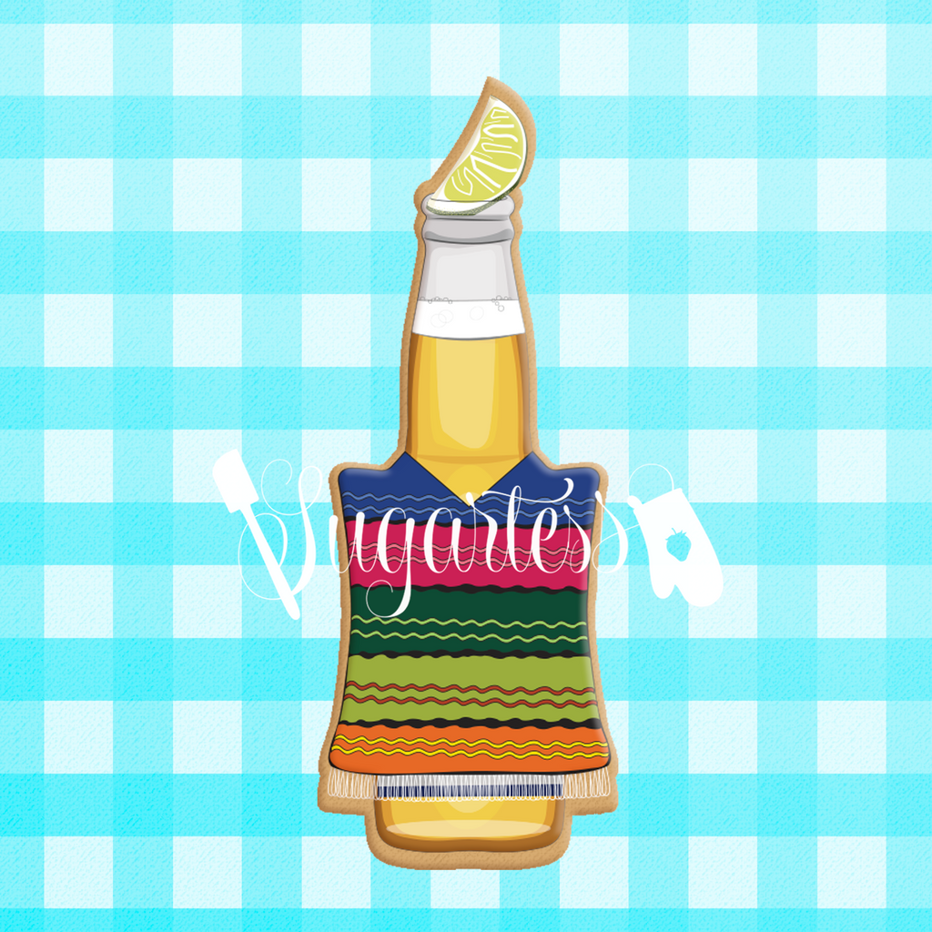 Sugartess custom cookie cutter in shape of beer bottle with lemon wedge and Mexican poncho.