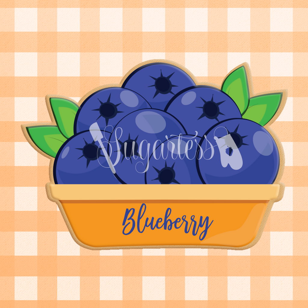 Sugartess custom cookie cutter in shape of blueberries inside a pie dish plate.