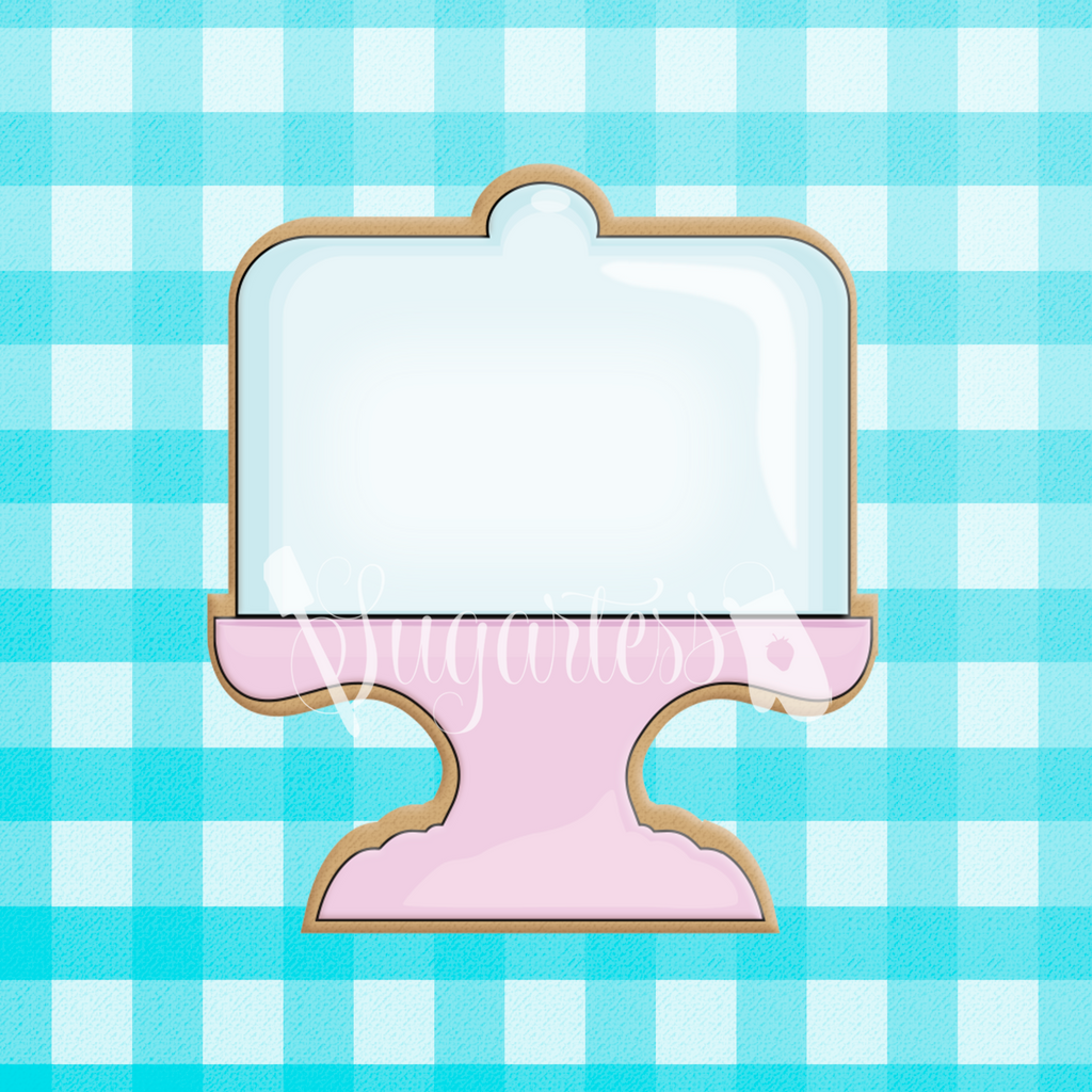 Sugartess custom cookie cutter in shape of pink cake stand with glass top cover.