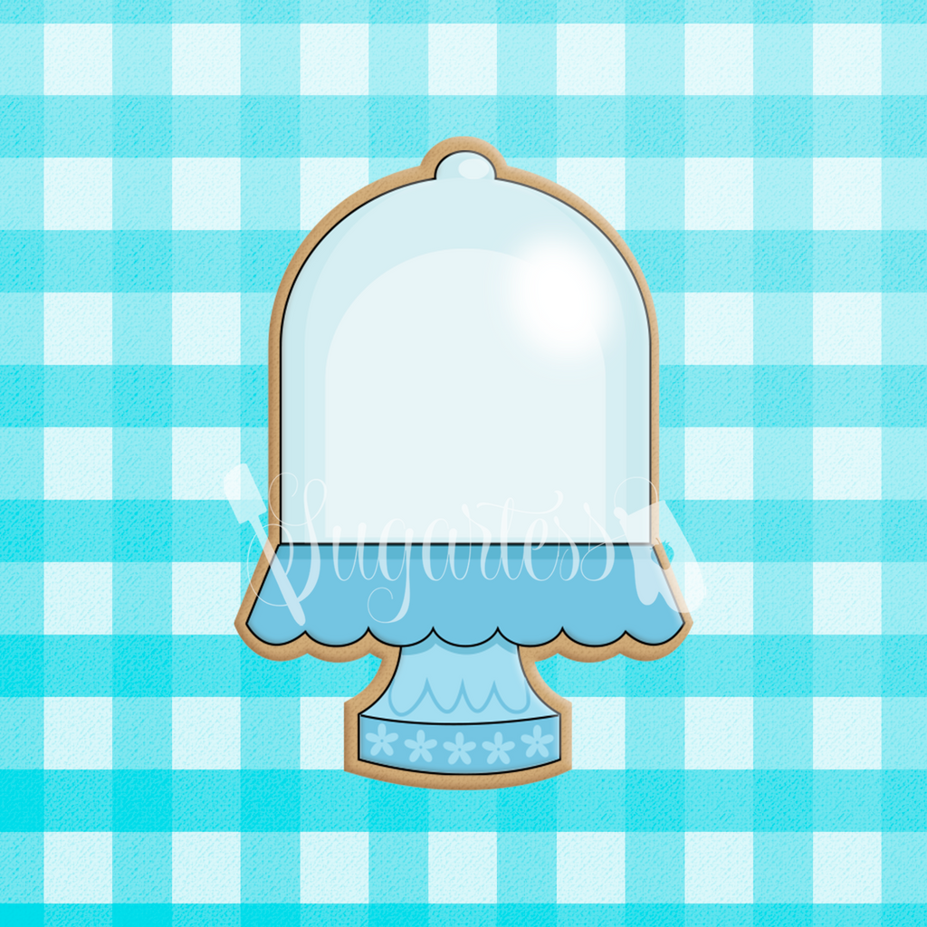 Sugartess custom cookie cutter in shape of blue cake stand with glass dome.