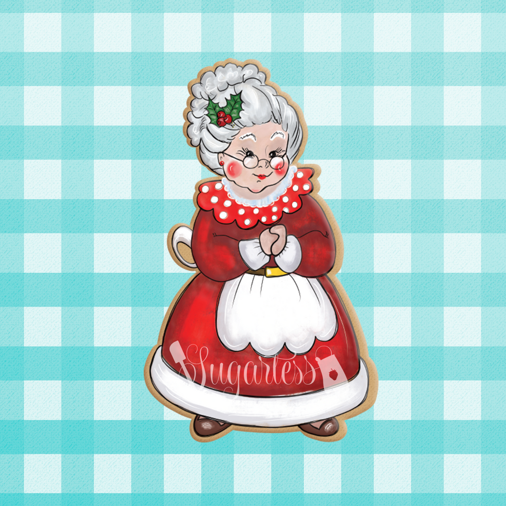 Sugartess custom Christmas cutter in shape of chubby Mrs. Claus standing .