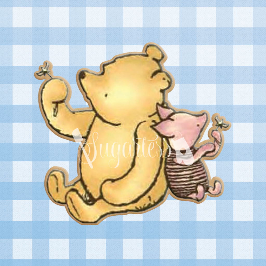 Sugartess custom cookie cutter in shape of classic Winnie The Pooh bear and Piglet holding flowers.