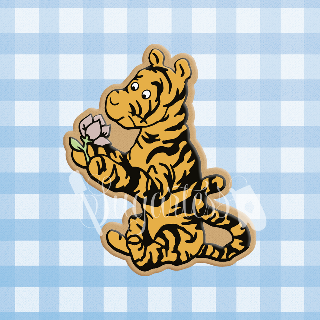 Sugartess cookie cutter in shape of classic Tigger character sitting and holding a flower.