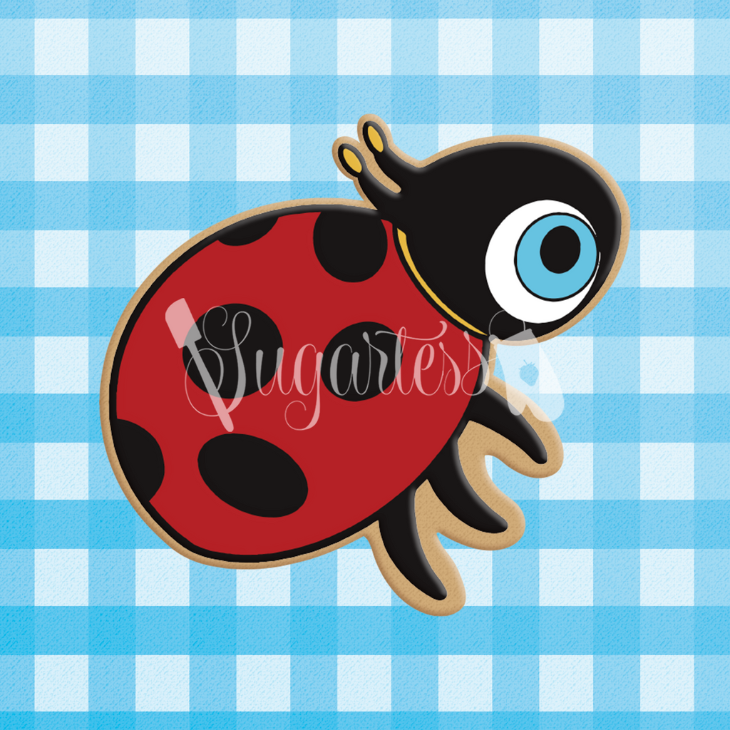 Sugartess cookie cutter in shape of CoComelon's logo lady bug.