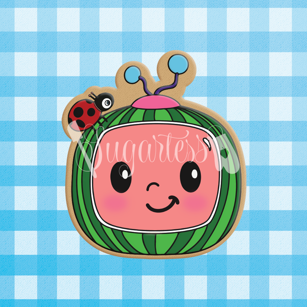 Sugartess character cookie cutter in shape of CoComelon's watermelon TV box with ladybug on top.