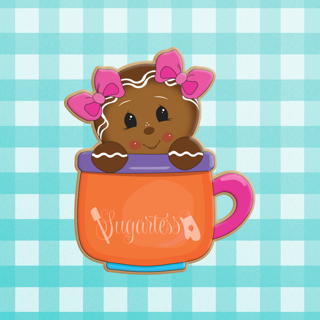 Sugartess custom holiday cookie cutter in shape of a gingerbread girl with 2 head bows peeking out of a mug.