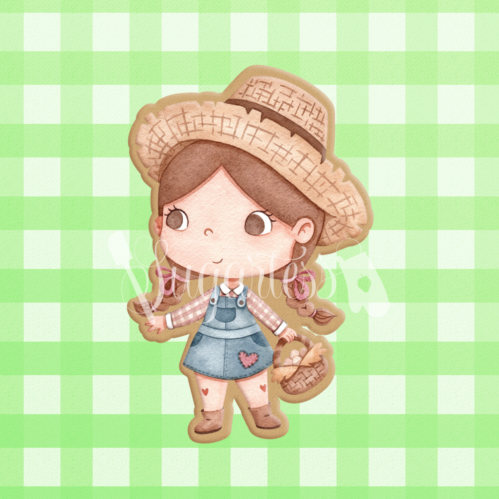Sugartess cookie cutter in shape of a farmer girl with hat and egg basket.