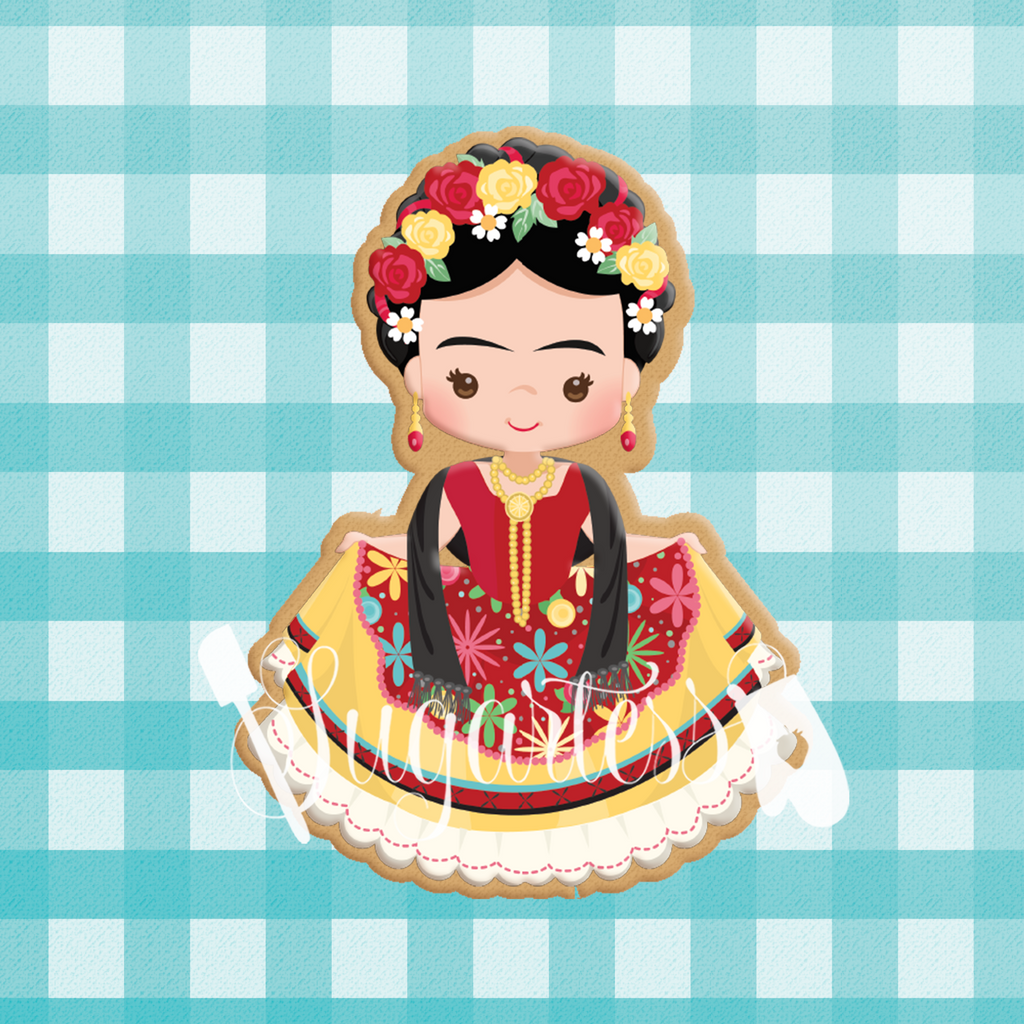 Sugartess custom cookie cutter in shape of Frida Khalo in traditional Mexican dress.