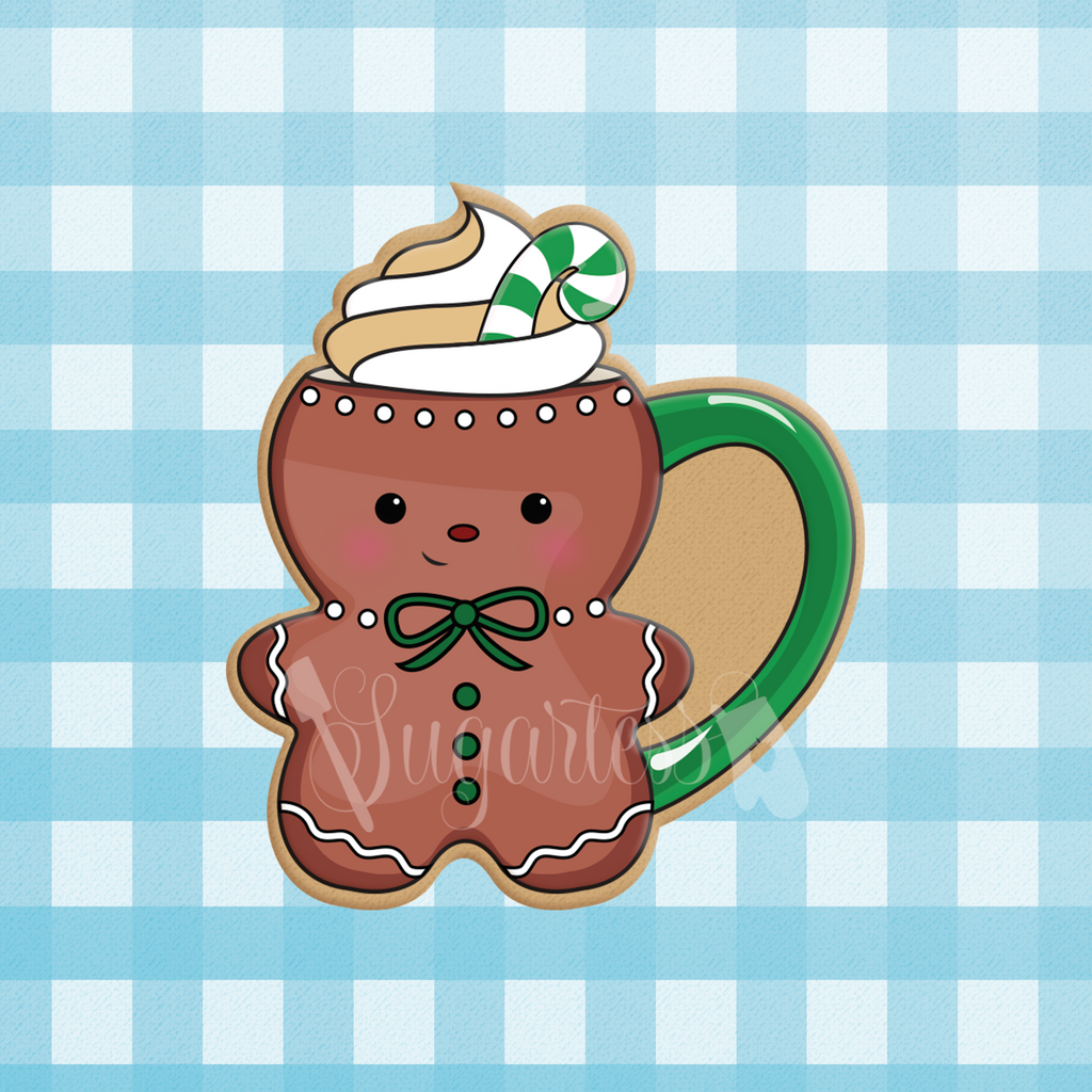 Sugartess Christmas cookie cutter in shape of Gingerbread Man mug cup topped with cream dollop and candy cane.