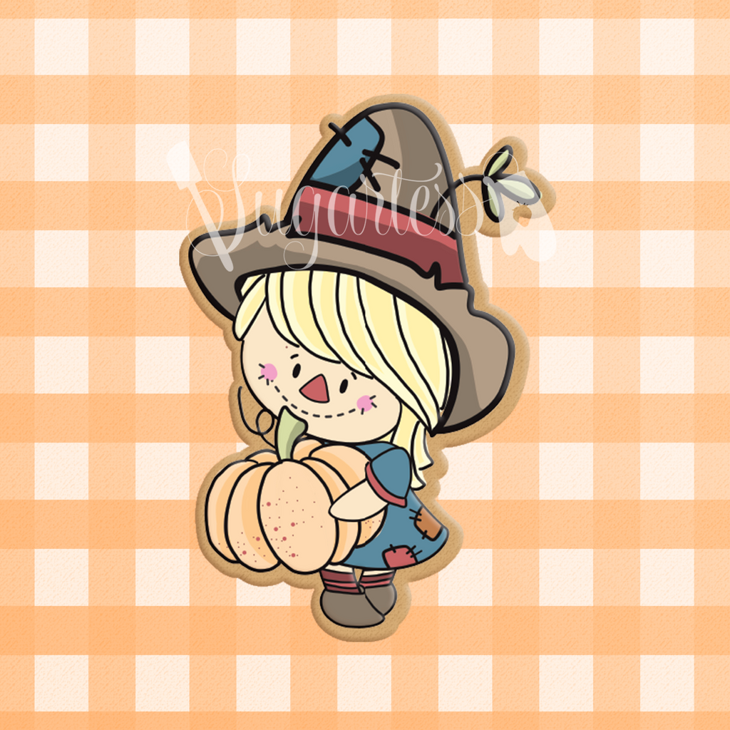 Sugartess custom cookie cutter in shape of Girl Scarecrow Farmer Carrying Pumpkin.