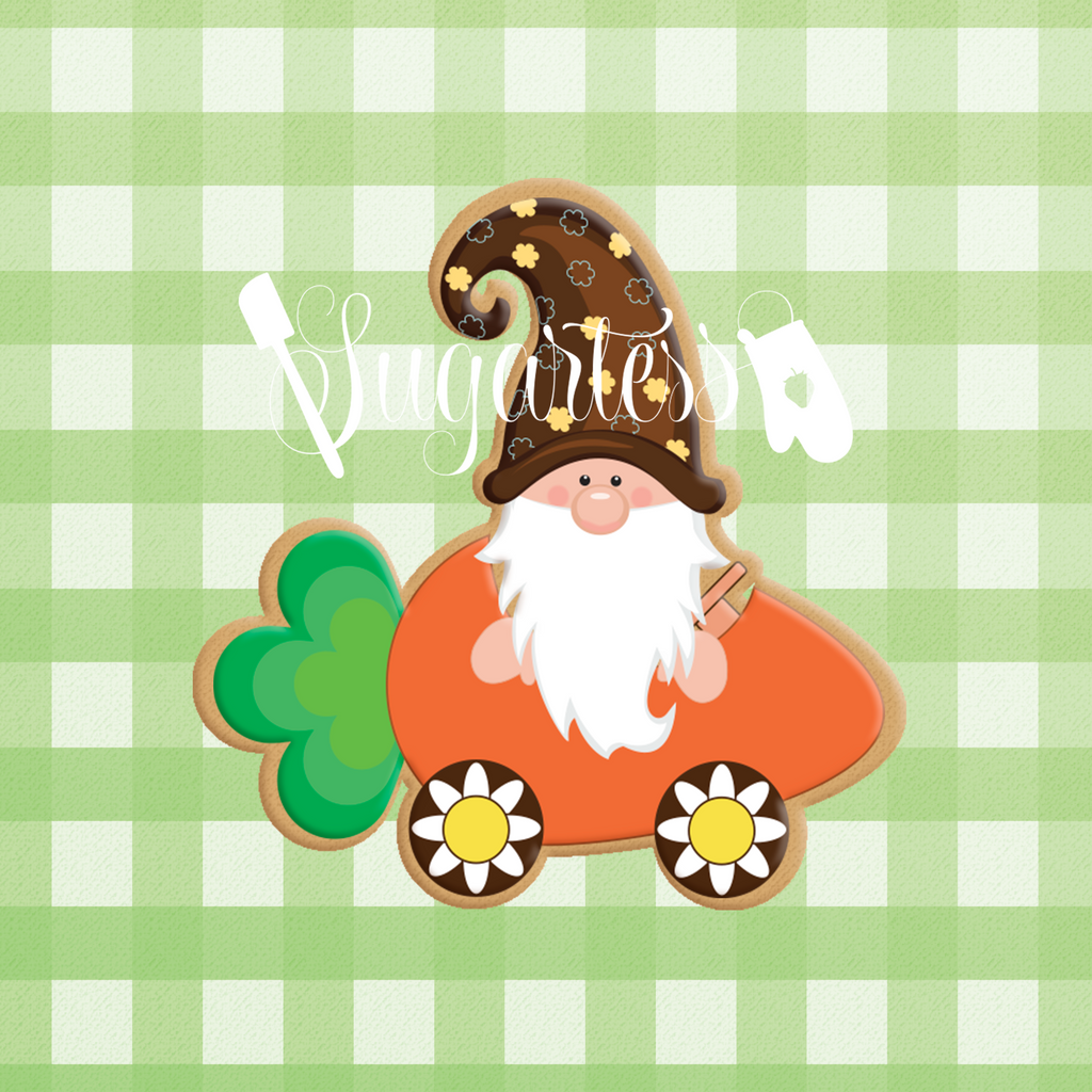 Sugartess custom cookie cutter in shape of a gnome riding a carrot-shaped vehicle.