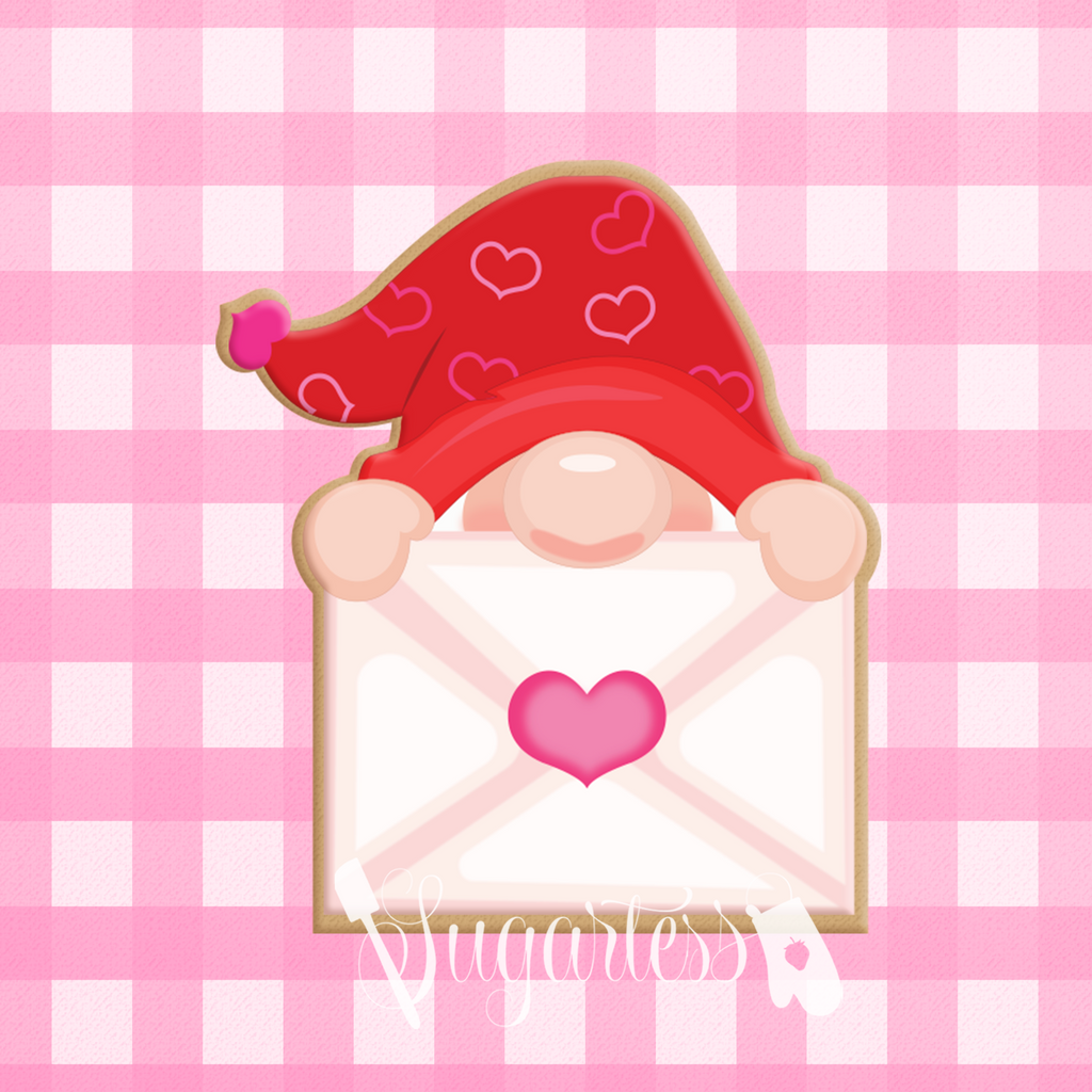 Sugartess custom cookie cutter in shape of a gnome's head peeking out holding a love letter.