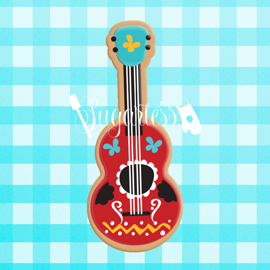 Sugartess custom cookie cutter in shape of guitar.