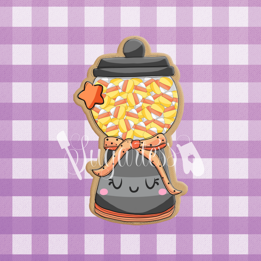 Sugartess custom cookie cutter in shape of a gumball machine filled with candy corn.