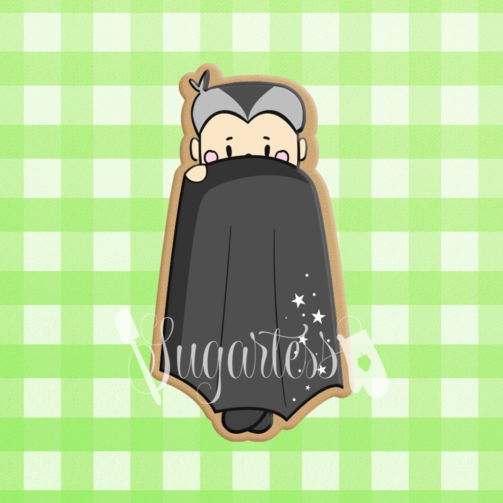 Sugartess custom Halloween cookie cutter in shape of a tall count Dracula vampire kid with cape covering body.