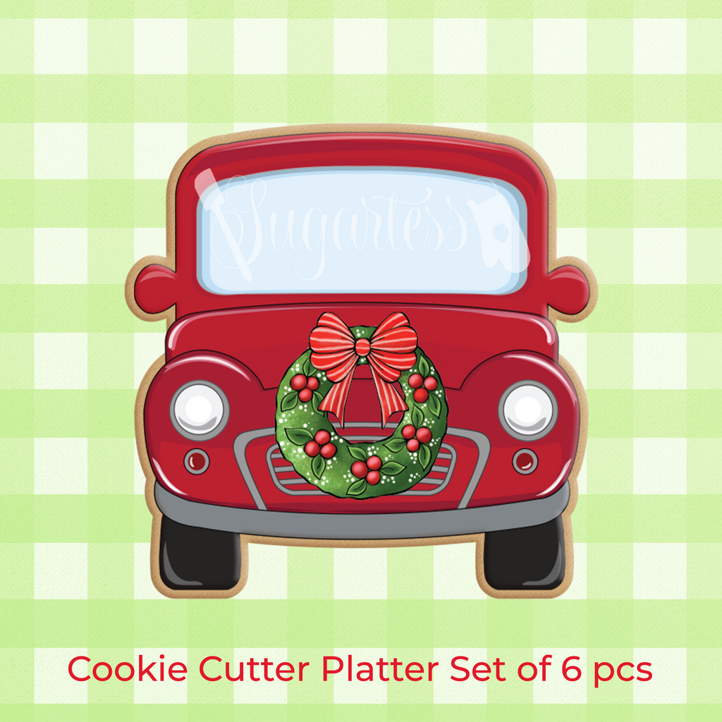 Sugartess custom cookie cutter in shape of a holiday red classic pickup truck front  with wreath on front.