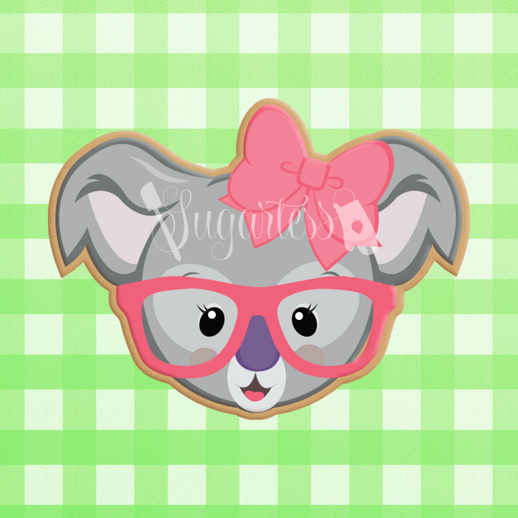 Sugartess custom cookie cutter in shape of girl koala bear head with bow and glasses.