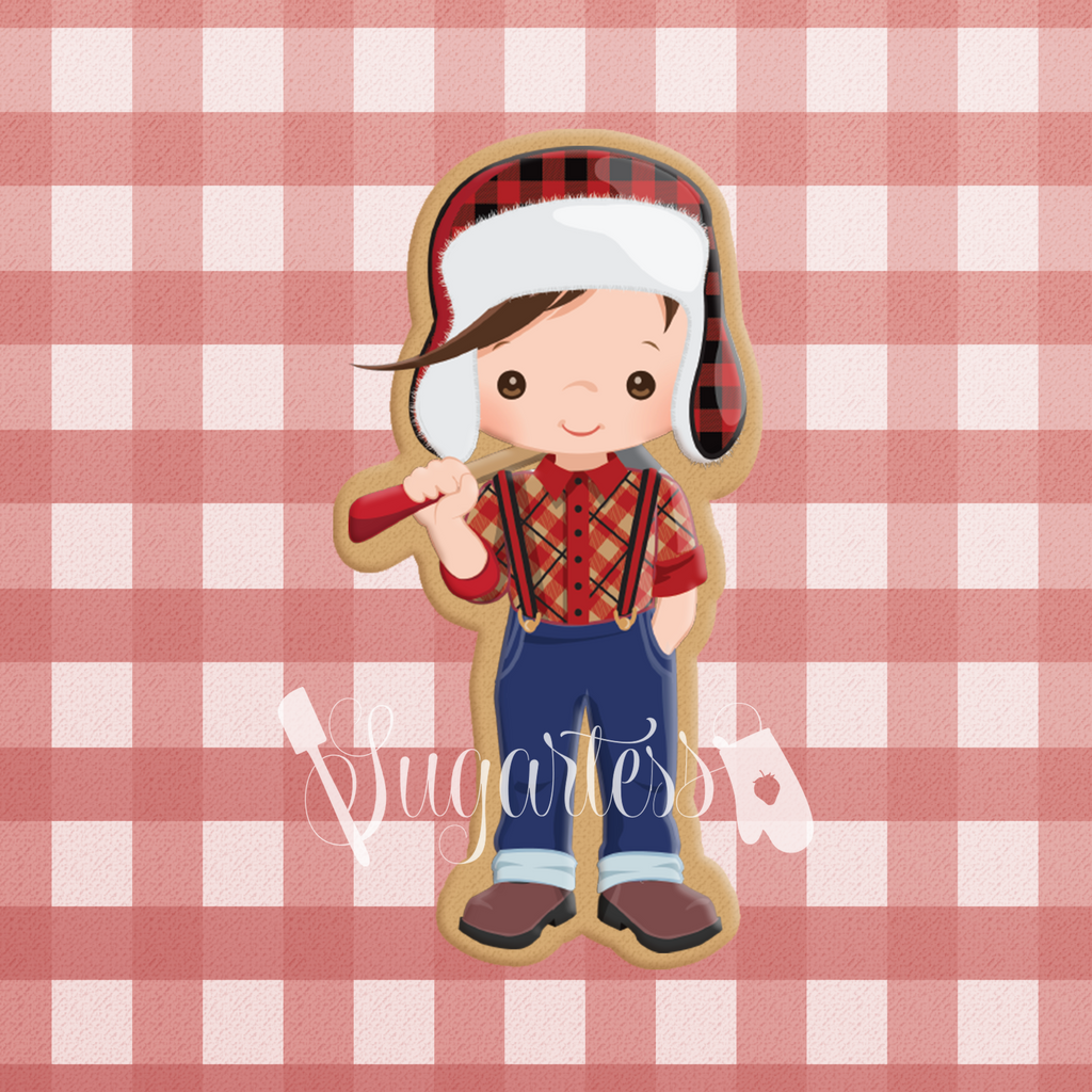 Sugartess custom cookie cutter in shape of a lumberjack kid wearing a trapper hat and carrying an ax.