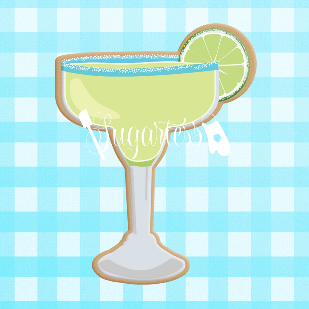 Sugartess custom cookie cutter in shape of margarita drink in blue-rimmed glass. with lemon wedge.
