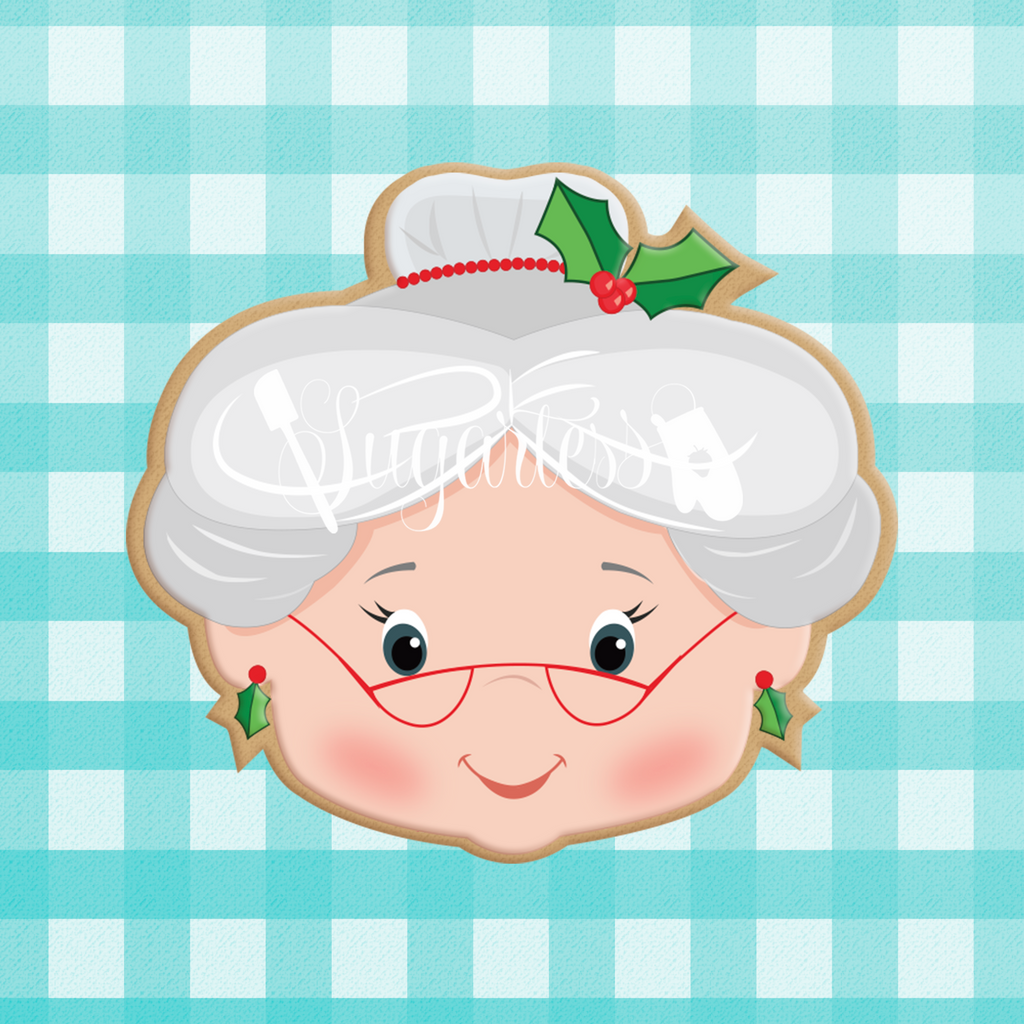 Sugartess custom holiday cookie cutter in shape of Mrs. Santa Claus Head with Holly Leaf Headpiece and Earrings.
