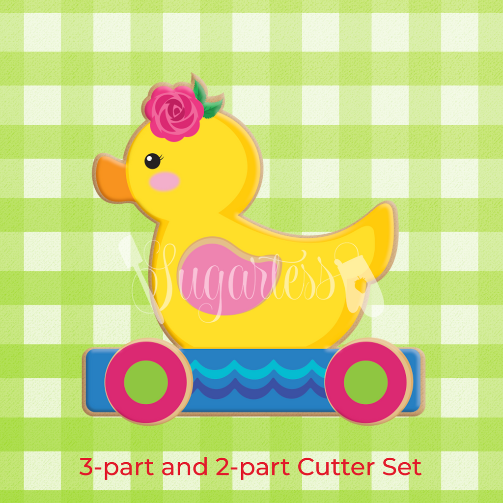 Sugartess custom 3-D baby cookie cutter in shape of a pull along girl duck with a single rose head piece.