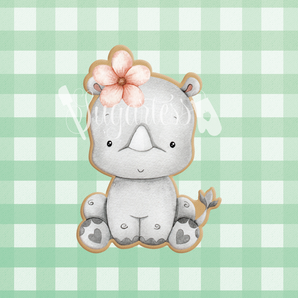 Sugartess cookie cutter in shape of a sitting baby girl rhino with Flower Headpiece.