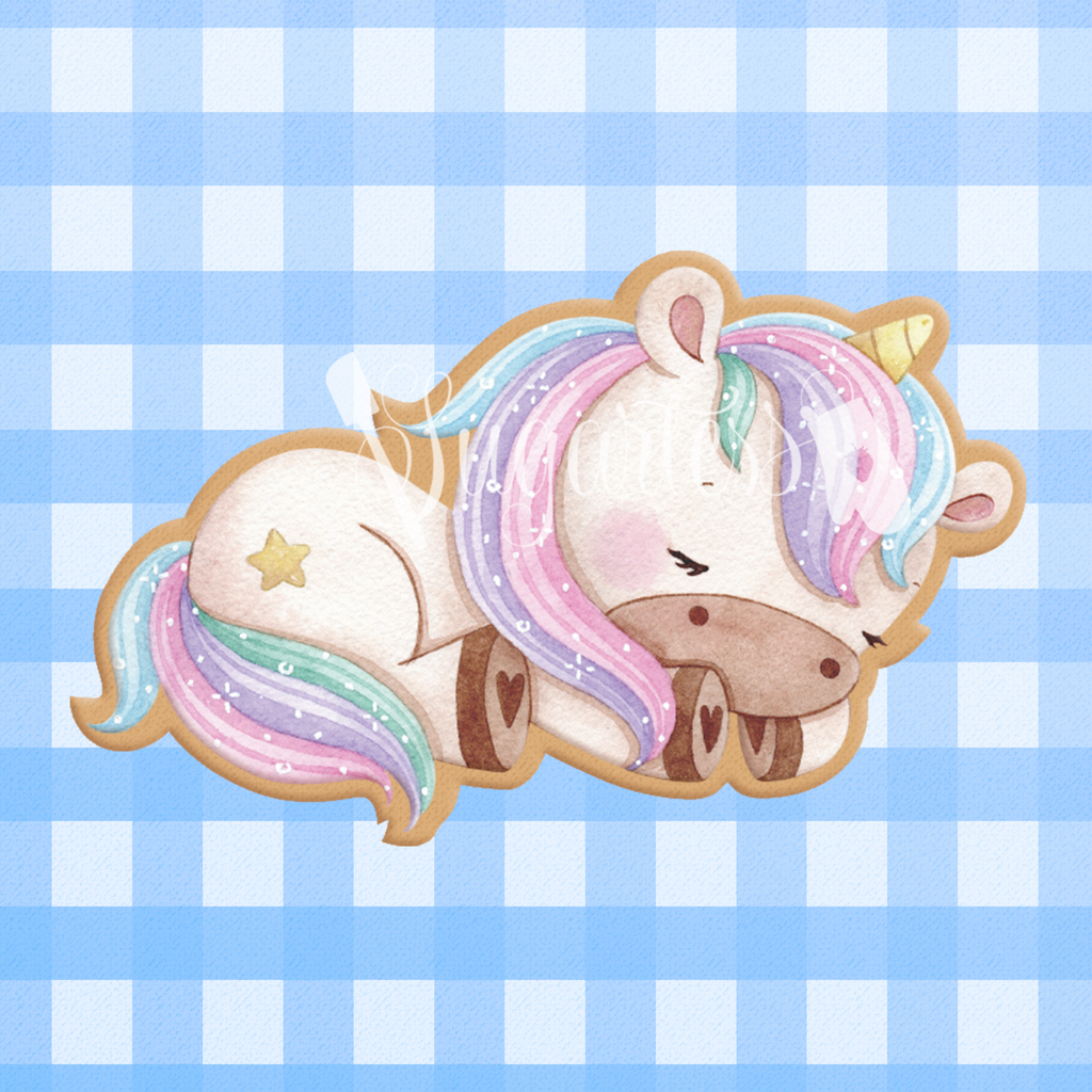 Sugartess custom cookie cutter in shape of a sleeping unicorn.